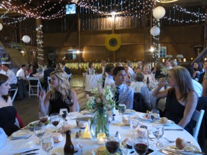 Tea  lights draped over the barn rafters