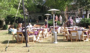 Crew sets up tea lights for wedding reception